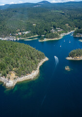 Boat wake as seen from the sky in clear blue water