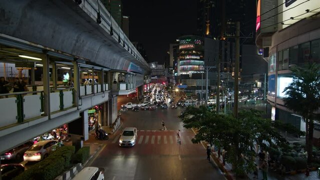 Night View of Bangkoks Busy City Street With Cars and People