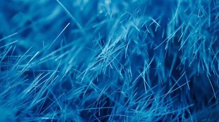 Macro shot of blue abstract grass-like structures, capturing intricate details and fine textures in close-up background with copy space .