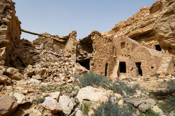 Ruins of dwellings in Ghomrassen located in a rocky valley, Tataouine, Tunisia