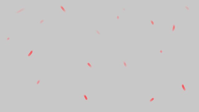 On a gray background, small particles flicker and sparkle with rainbow colors. Imitation of festive tinsel or the flight of sparkles after explosions of firecrackers or paper fireworks.