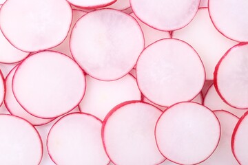 Slices of fresh ripe radish as background, top view