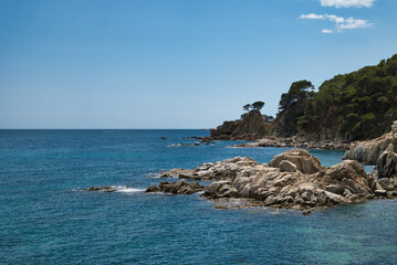Boats anchored near the rocky beach in Calella de Palafrugell, a fishing village on the Costa Brava...