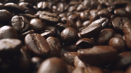 Macro shot of super slow motion shot of fresh coffee bean placed with black background. Close up of...