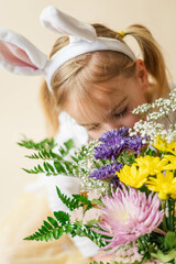 little girl with bunny ears