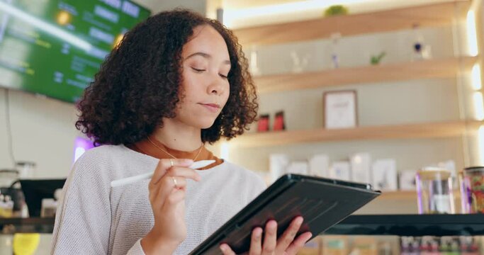 Woman, thinking and writing on tablet in store for inventory or stock control of cannabis edibles, sweets and retail. Girl, thoughts and digital technology for tracking or recording products.