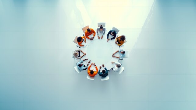 A group of diverse business professionals engaged in a roundtable discussion
