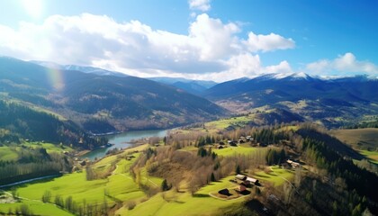 Obraz premium Views of fertile land surrounded by stunning green vegetation, rolling hills and mountains with clear skies in spring.