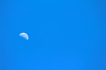 moon in the sky. white moon on the sky. Blue sky with moon. Moon in blue sky.