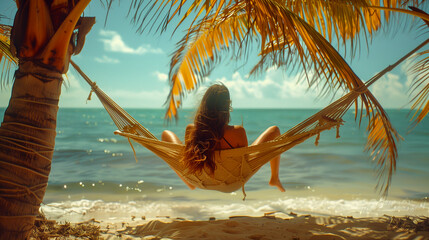 Summer: A woman lounging on a hammock strung between two palm trees.