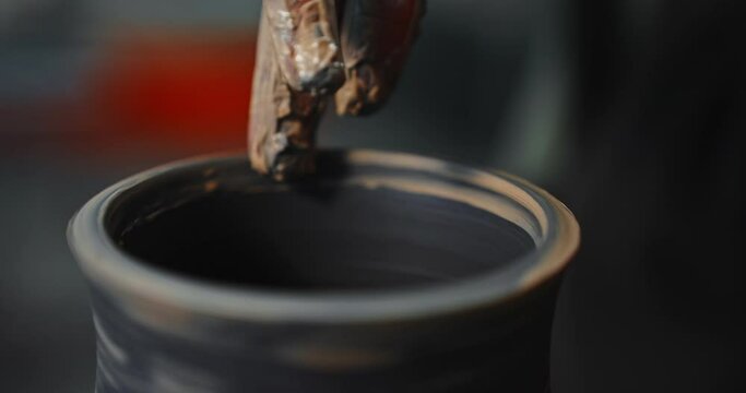 Artisan Craftswoman Molding a Clay Bowl