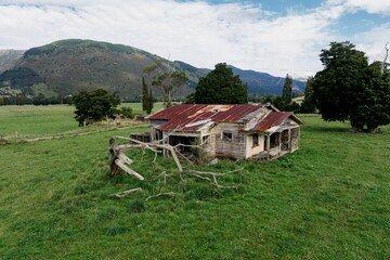 Abandoned and destroyed farmhouse  in Takaka, Tasman, New Zealand.