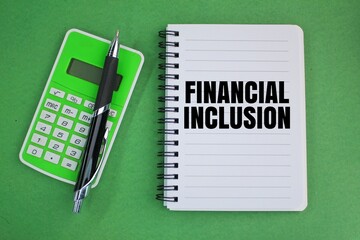 pen, calculator and book with the word FINANCIAL INCLUSION