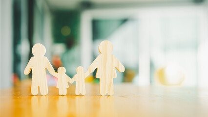 Family symbol with parents and children on hands of insurance agent looking out window view with...