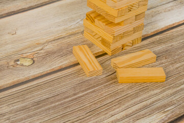 Wooden blocks on a light wooden tabletop background
