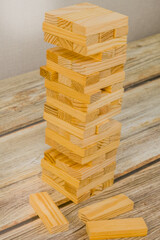 Tower of wooden blocks on a wooden tabletop. Generic version of popular game.