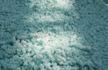 Scrap glass for recycling is melted into fiberglass.
