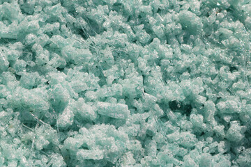 Close-up processed glass waste to recycle into fiberglass material.