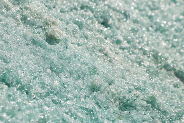 Waste glass processed for recycling melted into fiberglass.