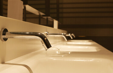 Sink faucet infrared sensor for public restroom.