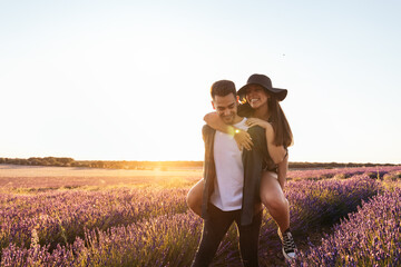 Lovely young couple in a floral field