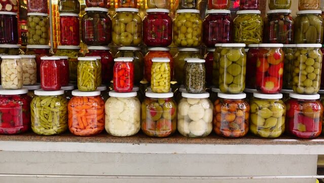 Canned fruits and vegetables in glass jars