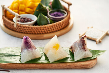 zongzi, rice dumplings,Made with glutinous rice and meat or egg yolk(Dates and Red Beans), wrapped in zong leaves, a common food for the Dragon Boat Festival in Asian countries.