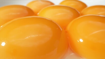 In exquisite detail, our macro captures the yolk's velvety texture and intense orange color, inviting you to savor the beauty of a perfectly cracked egg.
