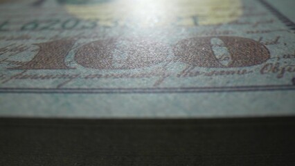 Detailed close-up of 100 USD banknotes, showcasing intricate textures and designs. Macro beauty in currency. Green bonds andImpact investing concept. Dollars Money Background. 
