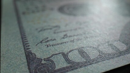 Experience the beauty of currency through close-up macro of a one hundred dollars bill, where...