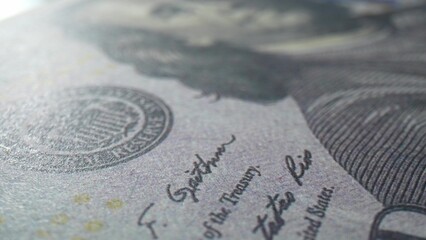 The beauty of currency through close-up macro of a hundred dollars bill, where intricate design...