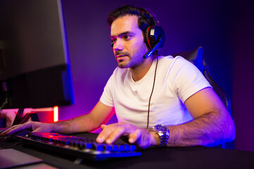 Smart gaming streamer talking with team member players using headset and mic for communicate with...