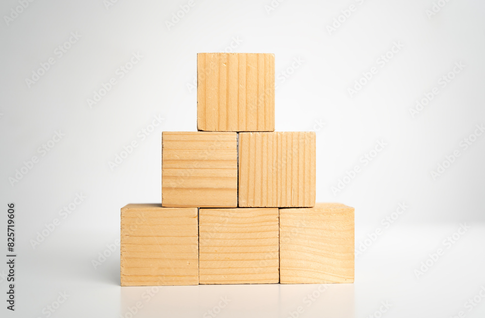 Poster empty blank wooden cube blocks build pyramid shape with the big one on top.