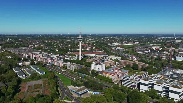 Aerial drone view of Fernsehturm Essen, a television station. The Essen TV Tower is a telecommunications tower located southwest of the city center in the Holsterhausen district of Essen. 