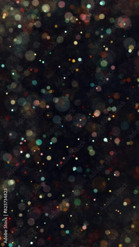 Poster colorful flickering blurred circle particles loop vertical animation.