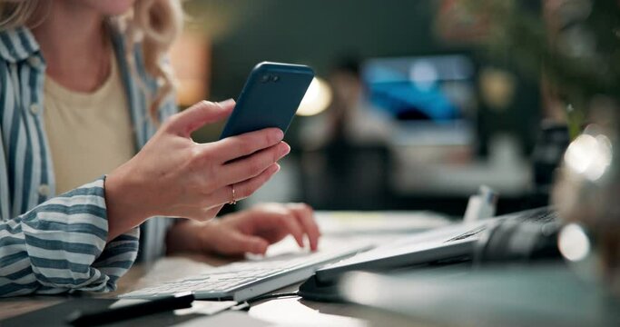 Cell phone, laptop and desk for woman on social media, office and scrolling for entertainment. Hands, online and digital texting for female person or web designer, distraction or break in workplace