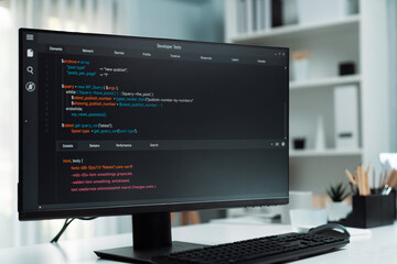 Program coding showing on pc monitor standing on desk working with empty developing engineer at modern office on break time to load server. Screen full stack data analyzing website design. Postulate.