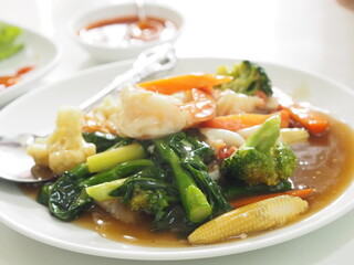 Thai style crab omelet, egg yellow food on white plate