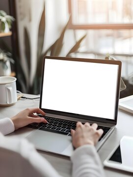 Mockup blank screen laptop computer. Business woman working on laptop computer at home office, planning work project on notebook. Student studying online via laptop, template for online marketing