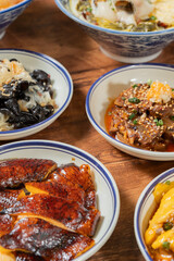 Collection of food including noodle, chicken, fish, beef