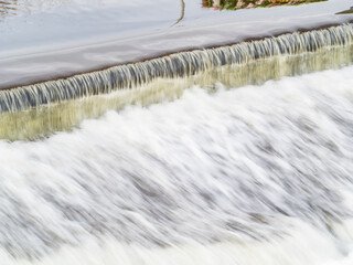 A small flat cascade in a calm river