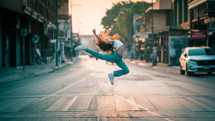 Beautiful girl ballerina dancing. Ballerina Performance Street Show in the city. A teenager poses as a ballet performer at a tourist attraction, in Chiang Mai, Northern Thailand.