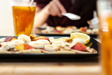 Breakfast plate pancake fruit and maple syrup.