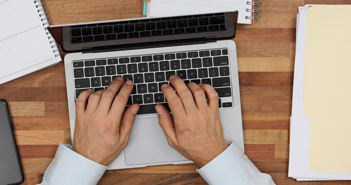 Frustrated office worker closes laptop top view