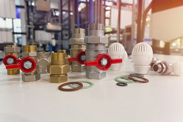 Valves, fittings, thermostats, rubber seals on the stand, plumbing production and repair