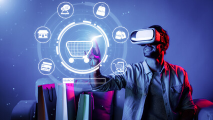 Happy man using VR headset and shopping online while sitting at sofa with shopping bags. Smart person looking at online market hologram and icon with neon background. Innovation technology. Deviation.