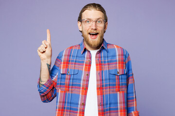 Young insighted smart proactive happy man he wear blue shirt casual clothes holding index finger up with great new idea isolated on plain pastel purple background studio portrait. Lifestyle concept.