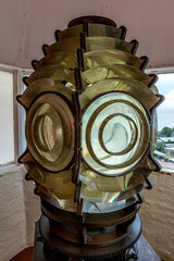 Fresnel lens of the searchlight of an old lighthouse tower in Georgetown, Guyana, South America, similar to the huge head of a humanoid robot with huge eyes. World tourism, attractions.