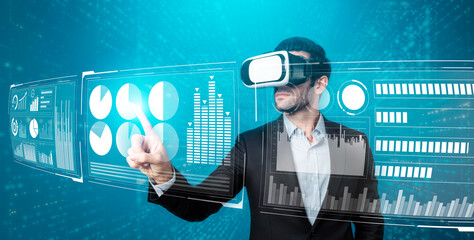 Skilled business man looking data analysis while planning strategy by using visual reality glasses. Professional smart investor checking financial graph holographic while wearing VR goggle. Deviation.