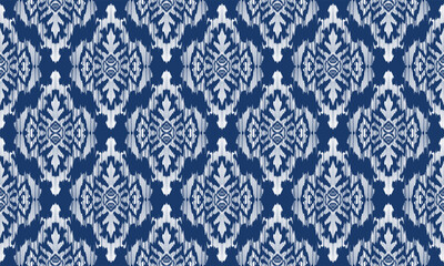 Hand draw Ikat floral paisley embroidery.Ikat ethnic oriental pattern traditional.Aztec style abstract vector illustration.blue background.great for textiles, banners, wallpapers, wrapping.
